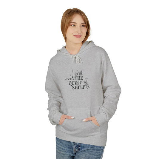 Person wearing a gray hoodie with 'The Quiet Shelf' design on a white background