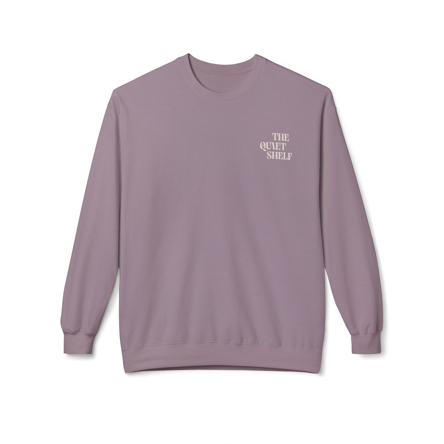 A purple crewneck sweatshirt with 'THE QUIET SHELF' written in a small, bold font on the upper left front side.