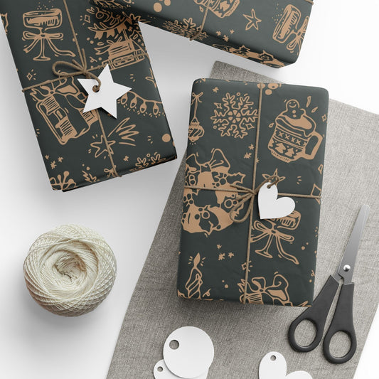 Dark gift wrap paper with gold patterns, scissors, and yarn on a white surface