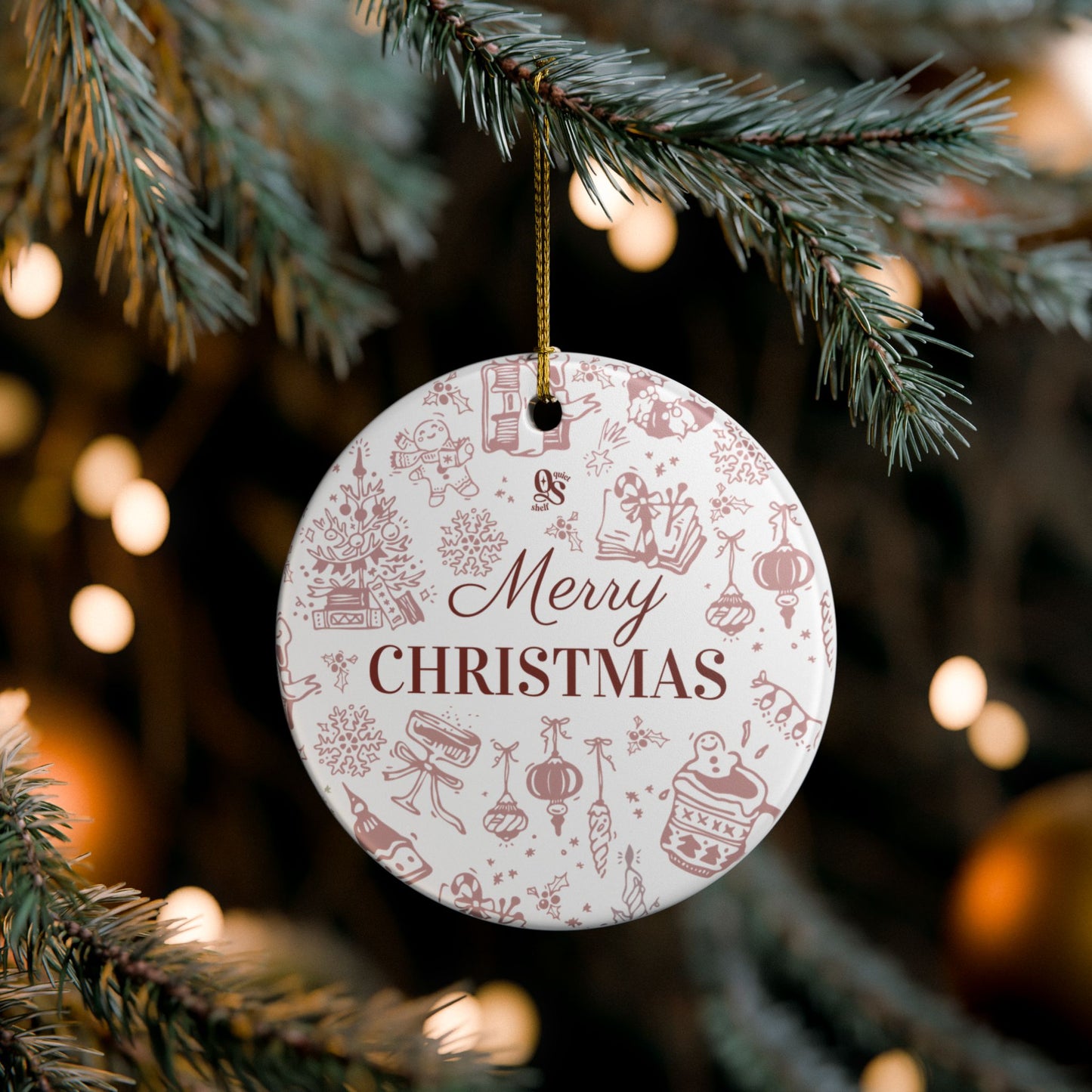 Round Christmas ornament with 'Merry Christmas' text hanging on a tree.