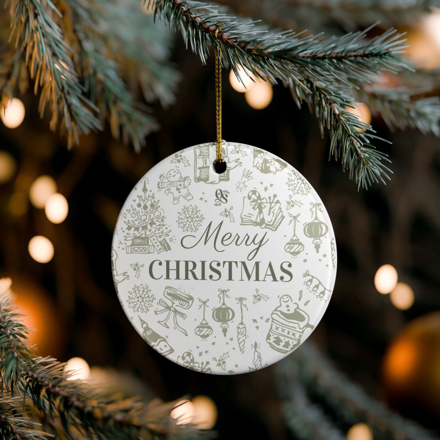 Round Christmas ornament with 'Merry Christmas' text hanging on a tree.