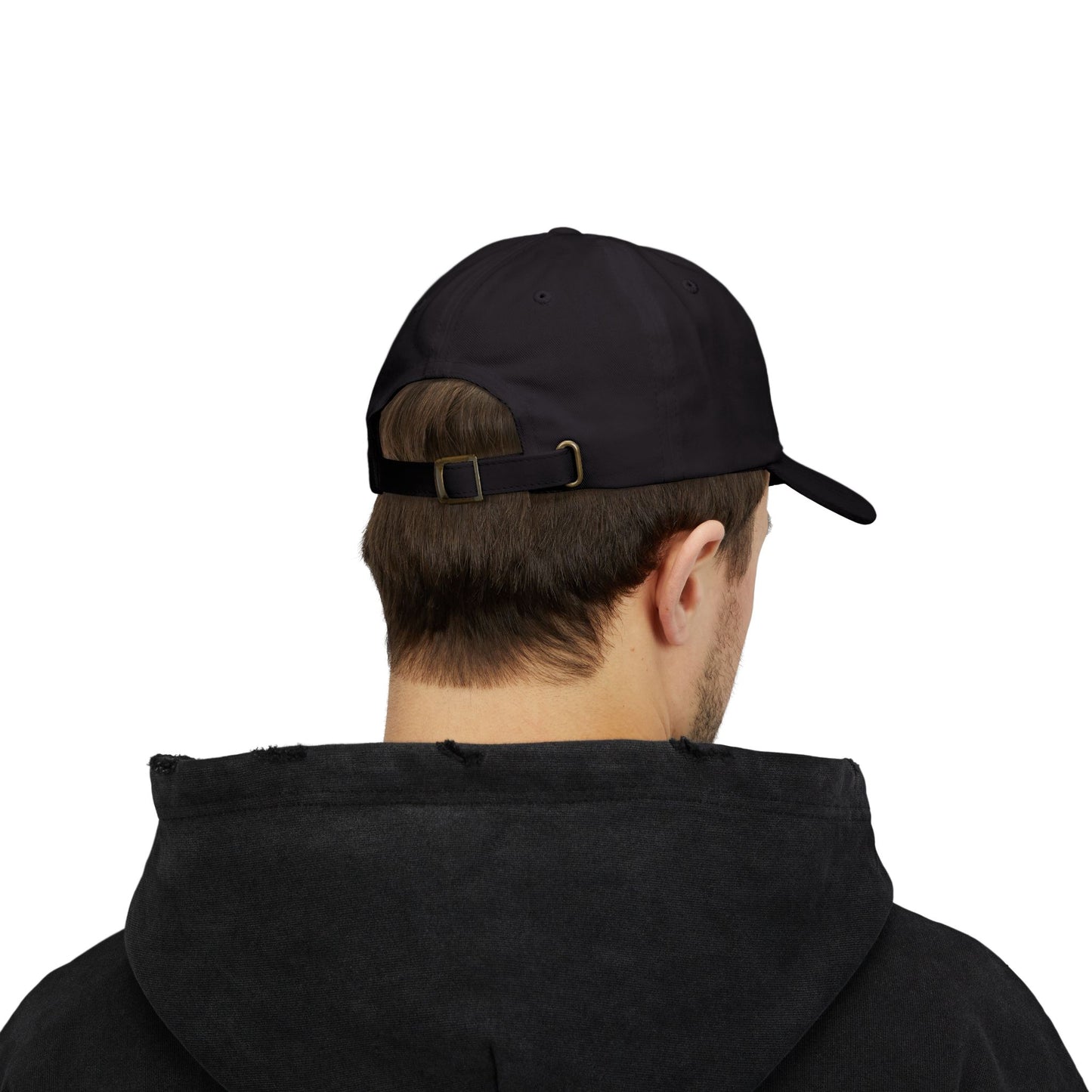 Person wearing a black cap and black hoodie on a white background