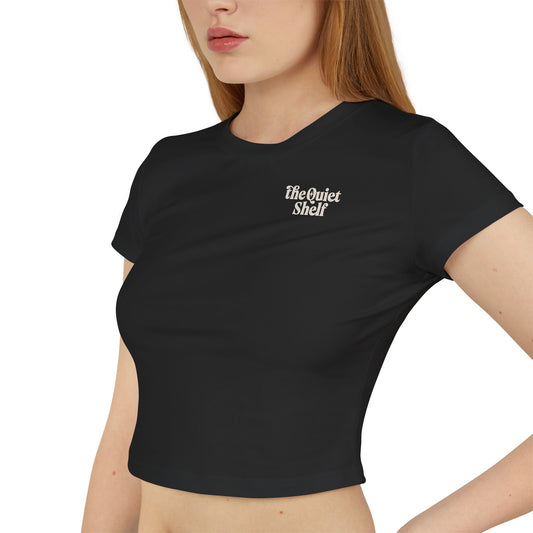 Black crop top with 'the Quiet Shelf' logo worn by a person on a white background