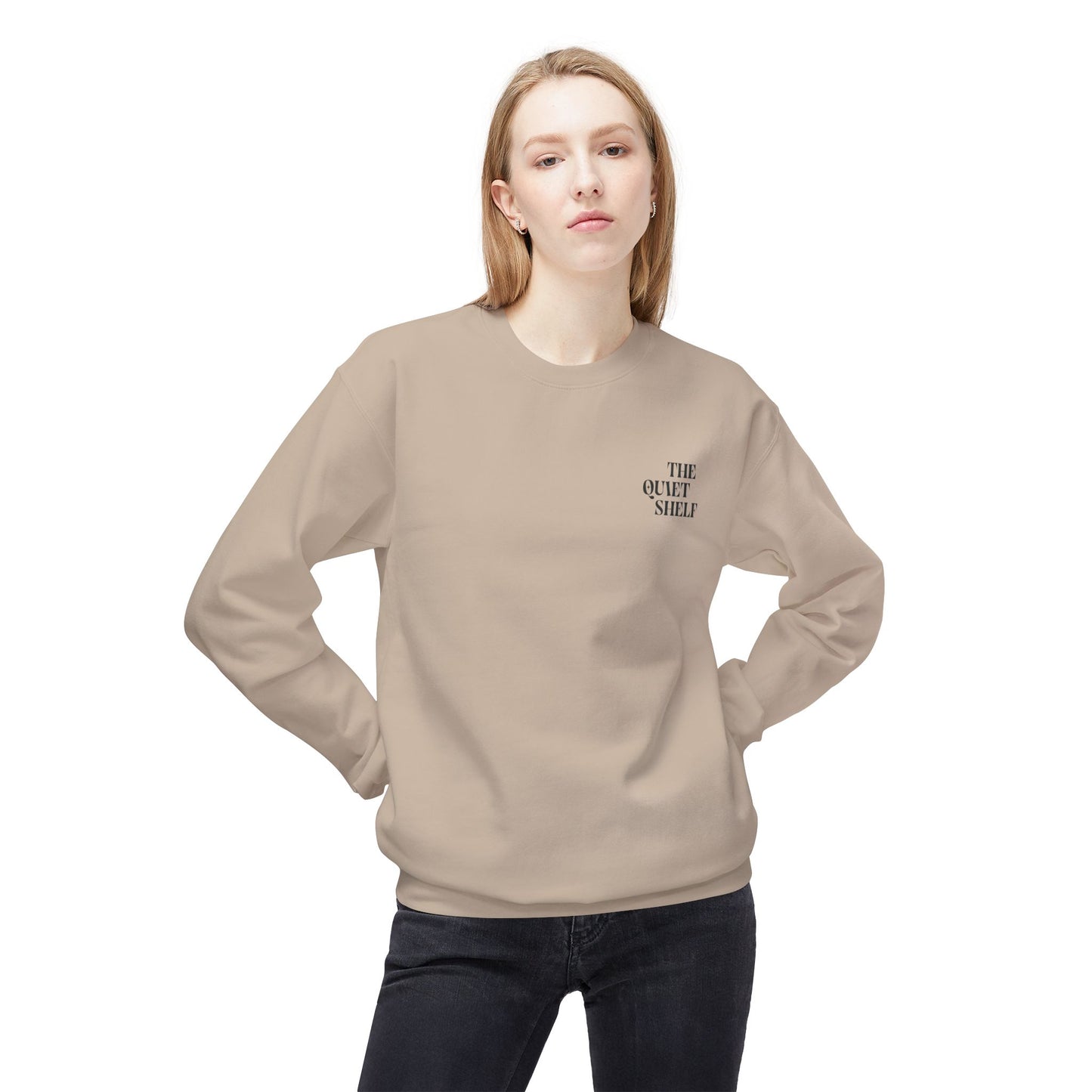 Person wearing a beige sweatshirt with text on a white background