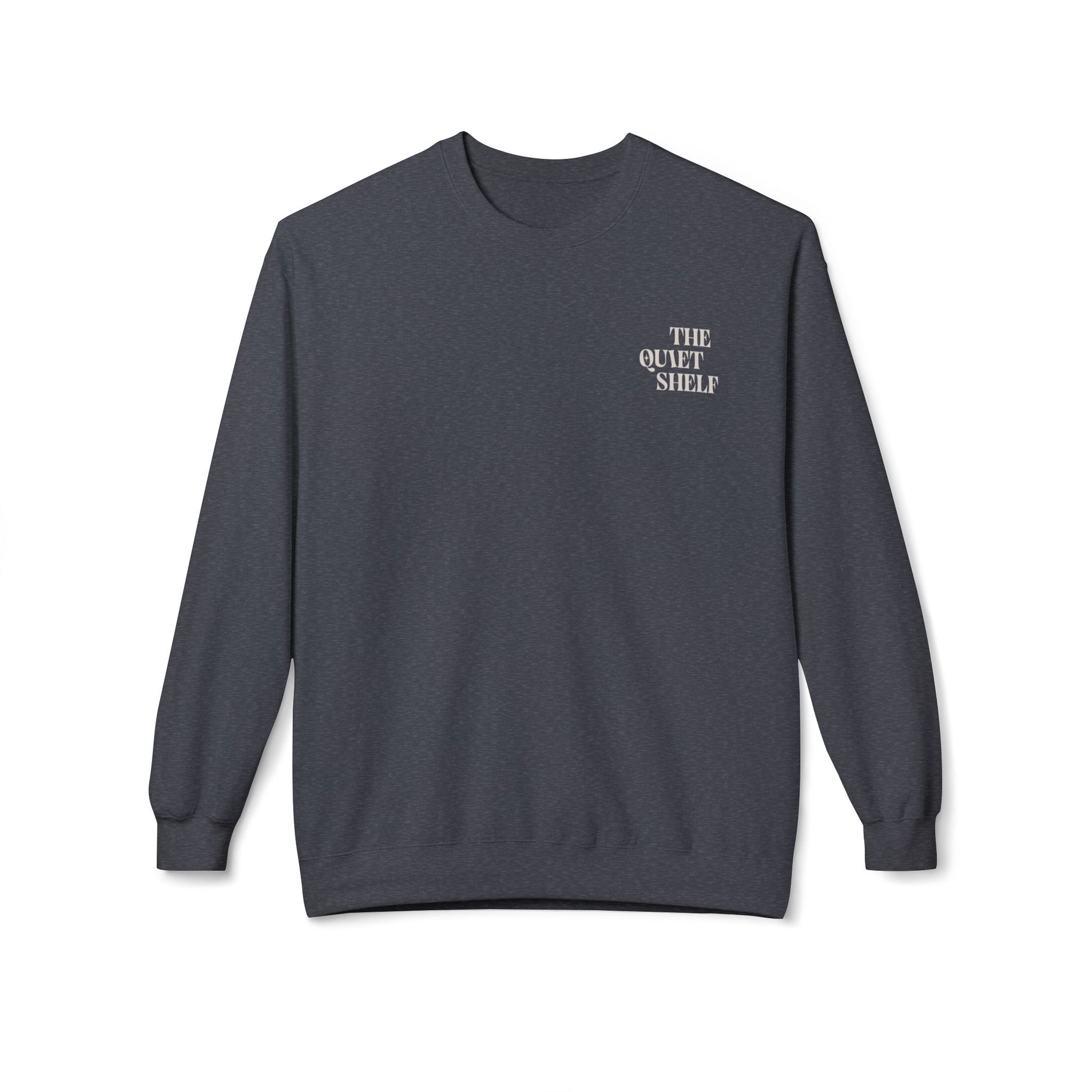 A black crewneck sweatshirt with 'THE QUIET SHELF' written in a small, bold font on the upper left front side.