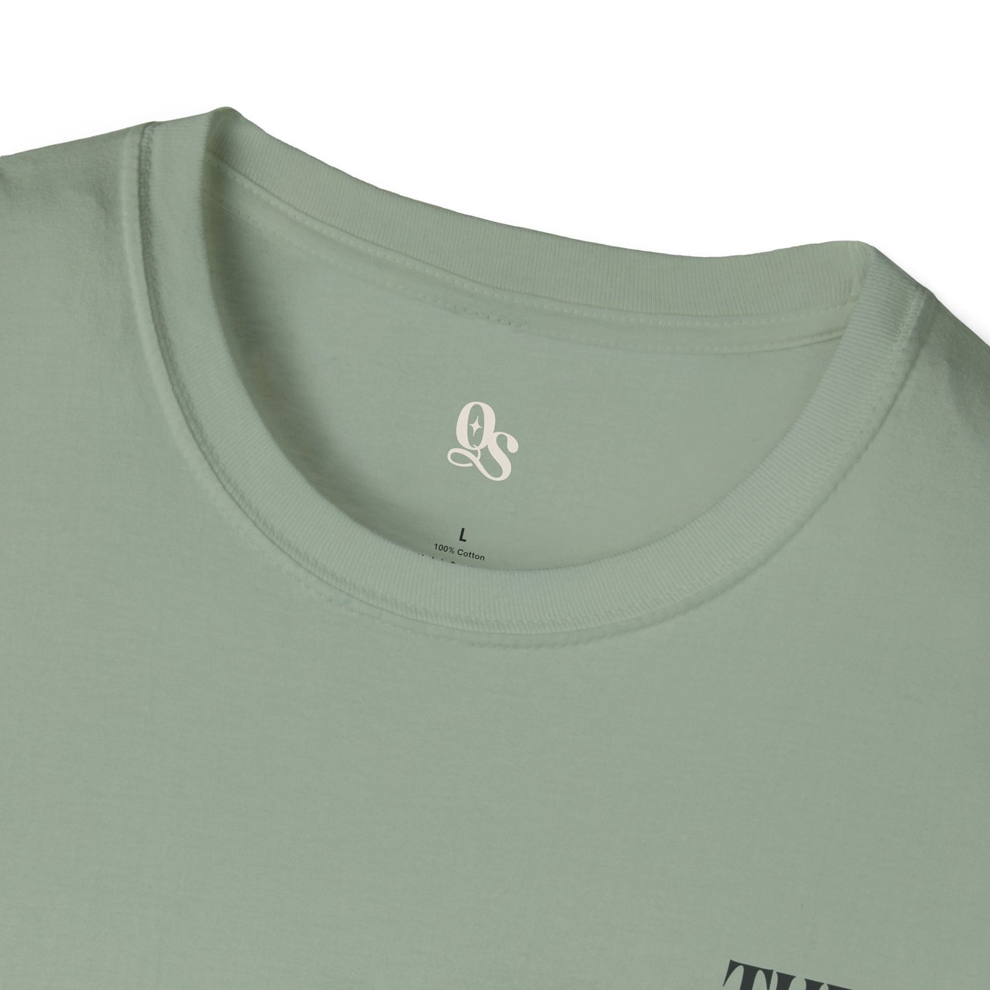 Close-up of a light green t-shirt with a logo on the collar.