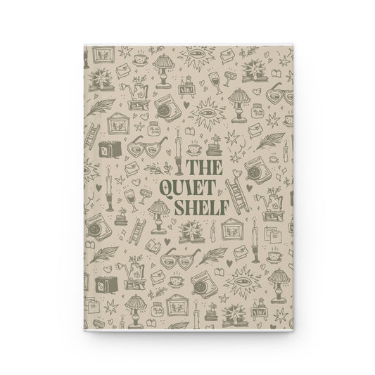 A pine green matte hardcover journal with line art illustrations of books, glasses, and other related items on the cover, titled 'THE QUIET SHELF'.