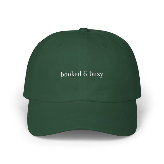 Green cap with 'booked & busy' text on a white background