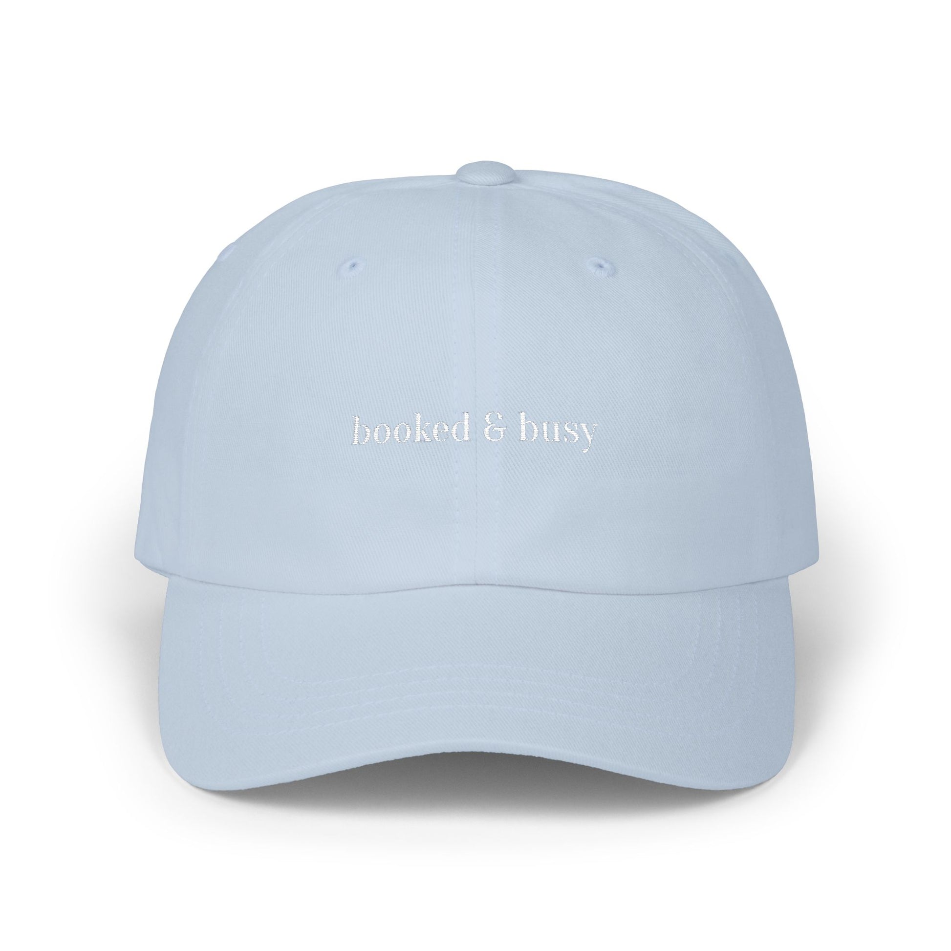 Light blue cap with 'booked & busy' text on a white background