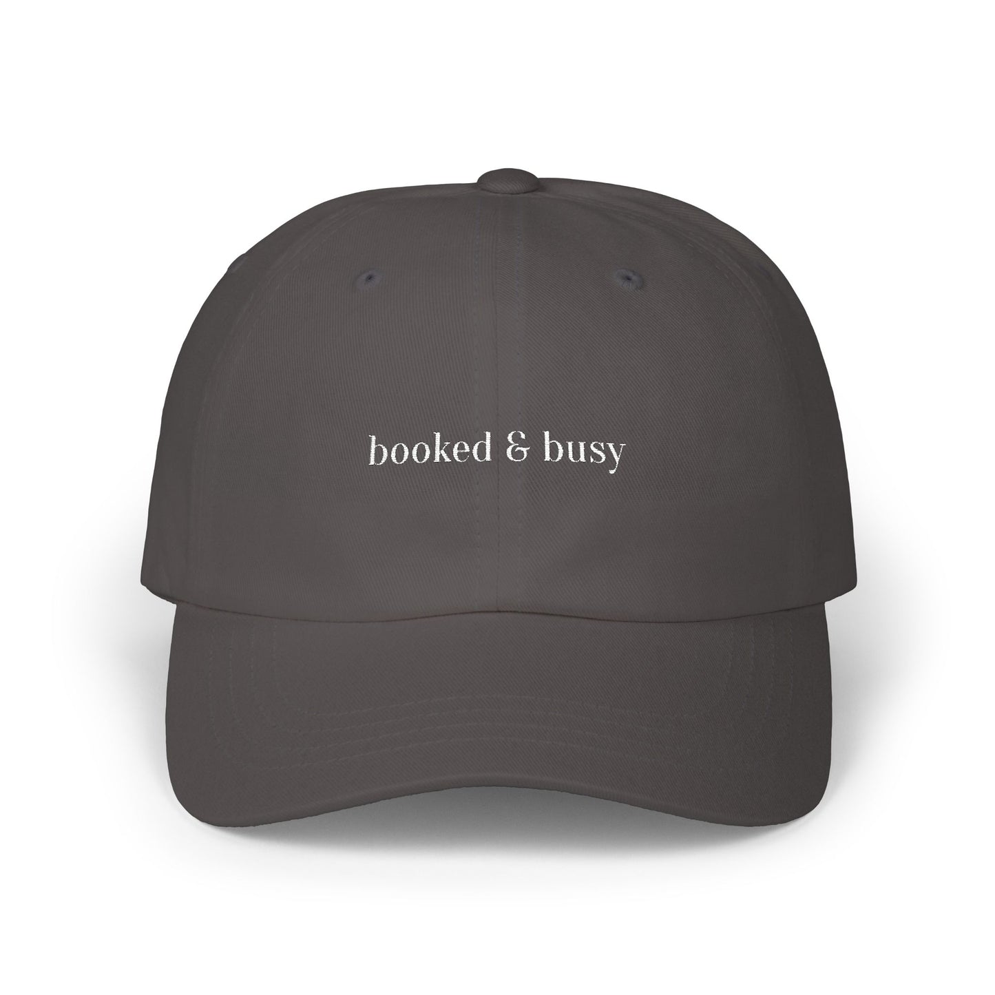 Dark gray cap with 'booked & busy' text on a white background