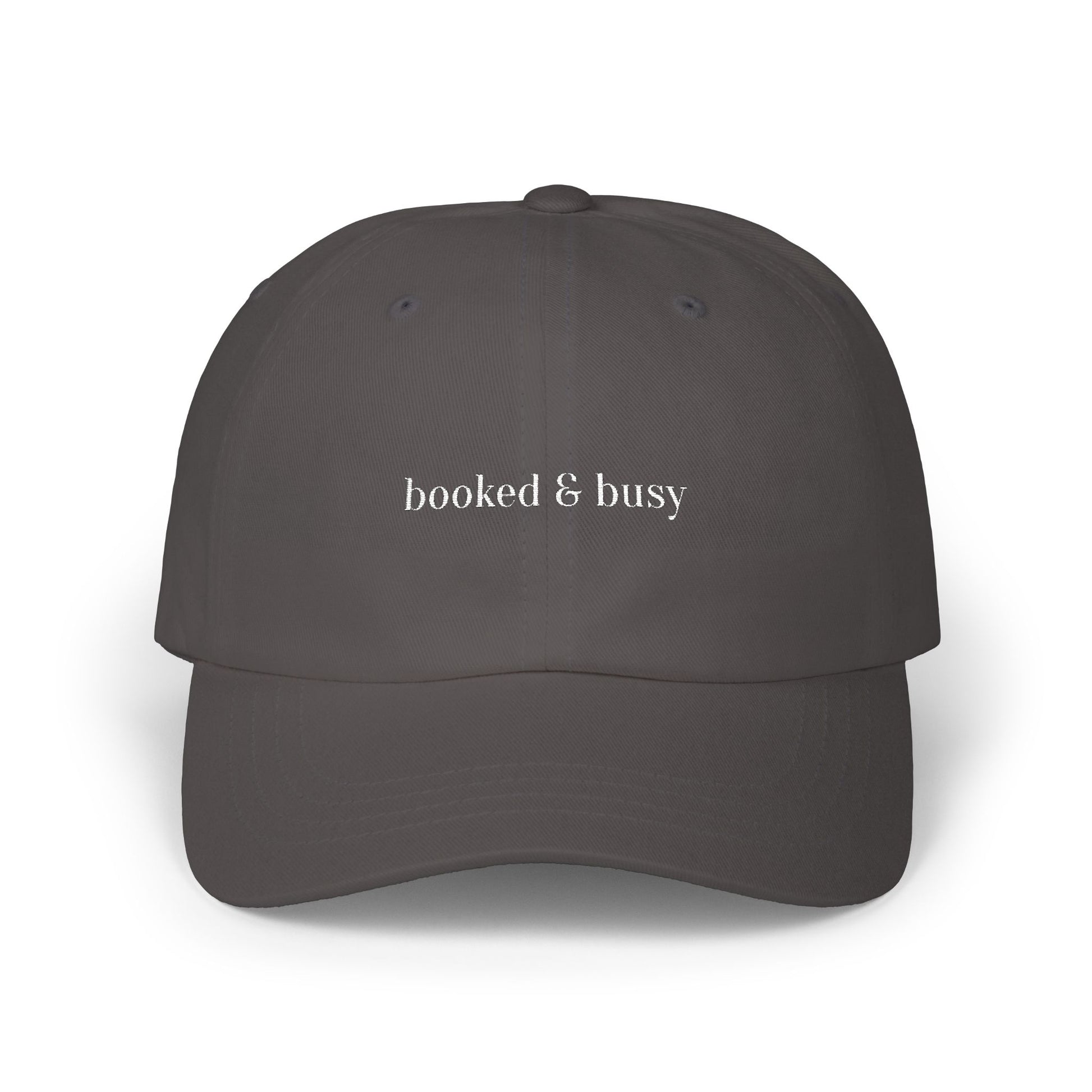 Dark gray cap with 'booked & busy' text on a white background