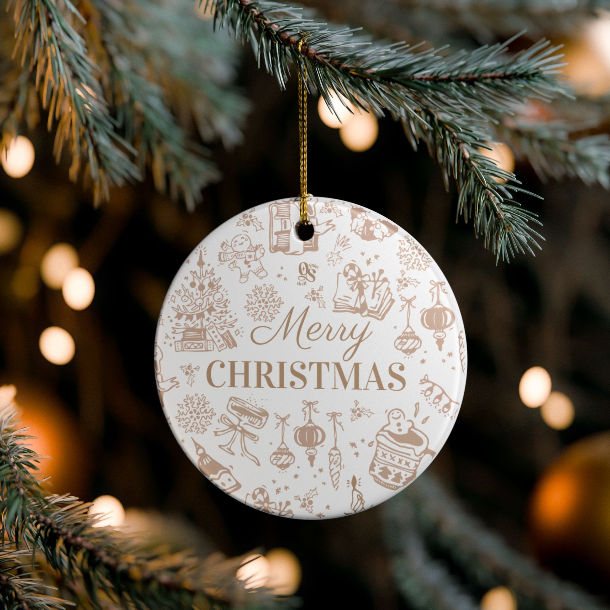 Round Christmas ornament with 'Merry Christmas' text hanging on a tree.