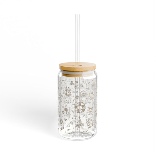 Clear glass tumbler with bamboo lid and straw on a white background