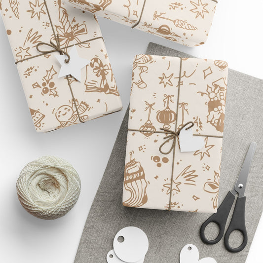 Gift wrapping paper with festive designs, scissors, and yarn on a gray surface.