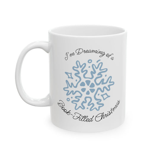 White mug with blue snowflake design and text on a white background
