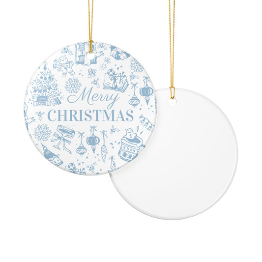 Round Christmas ornament with blue and white design and 'Merry Christmas' text on a white background.
