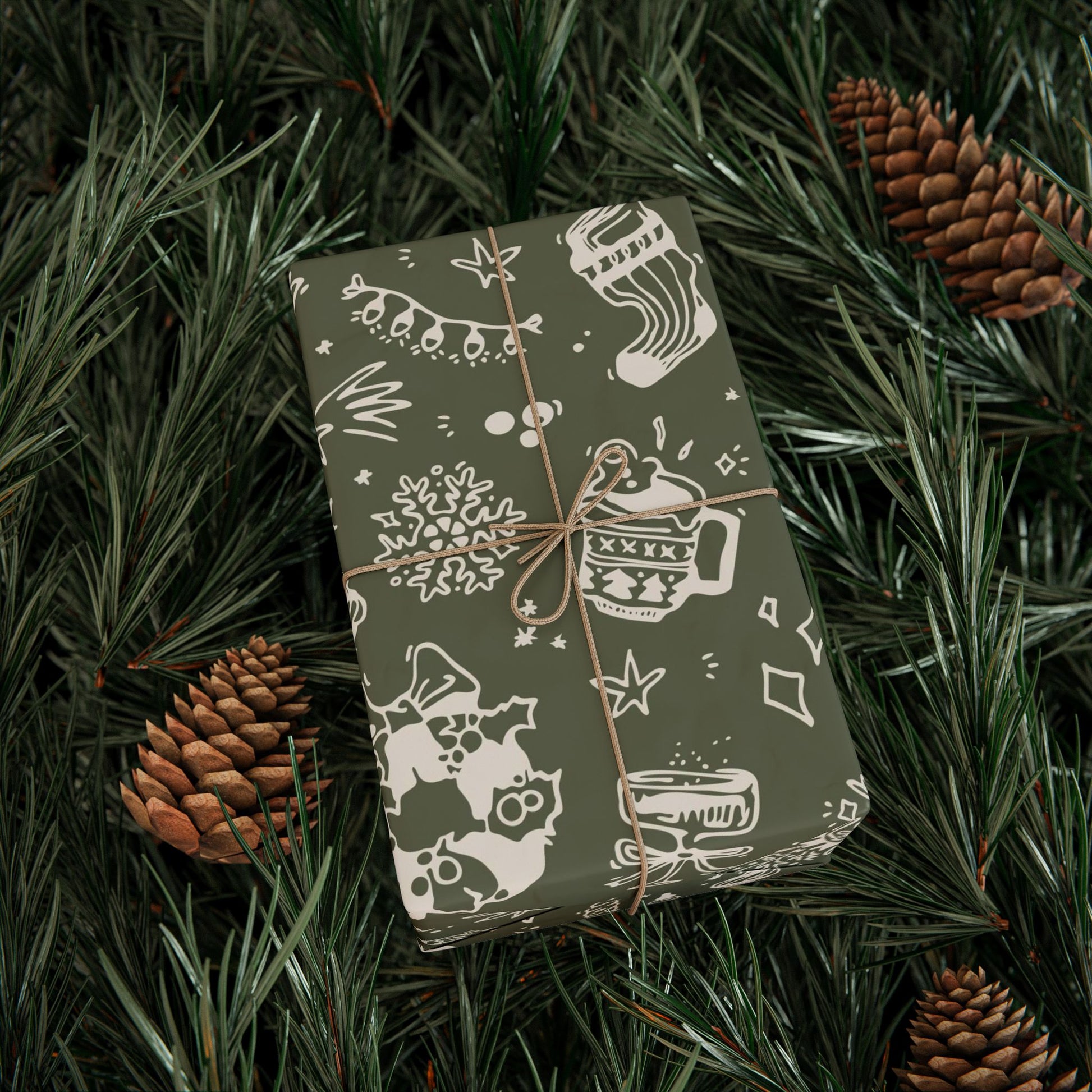 Gift box with festive design on green foliage