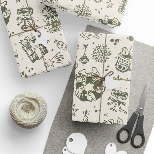 Gift boxes wrapped in patterned paper with a ball of yarn and scissors on a gray surface.