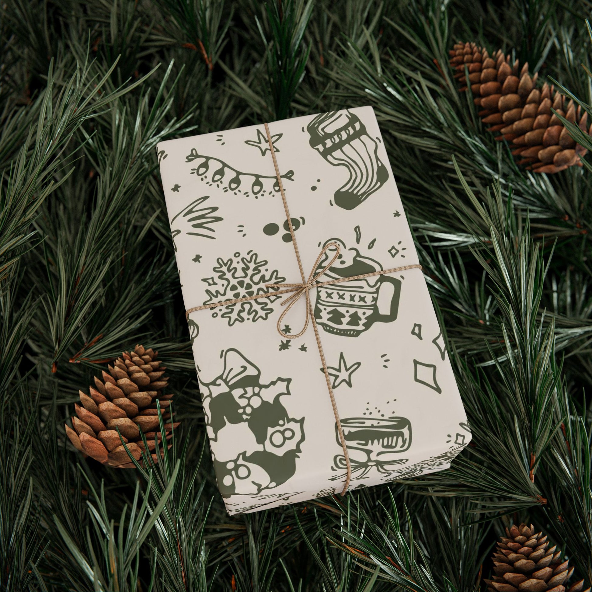 Gift wrapped in festive paper with pine cones and greenery