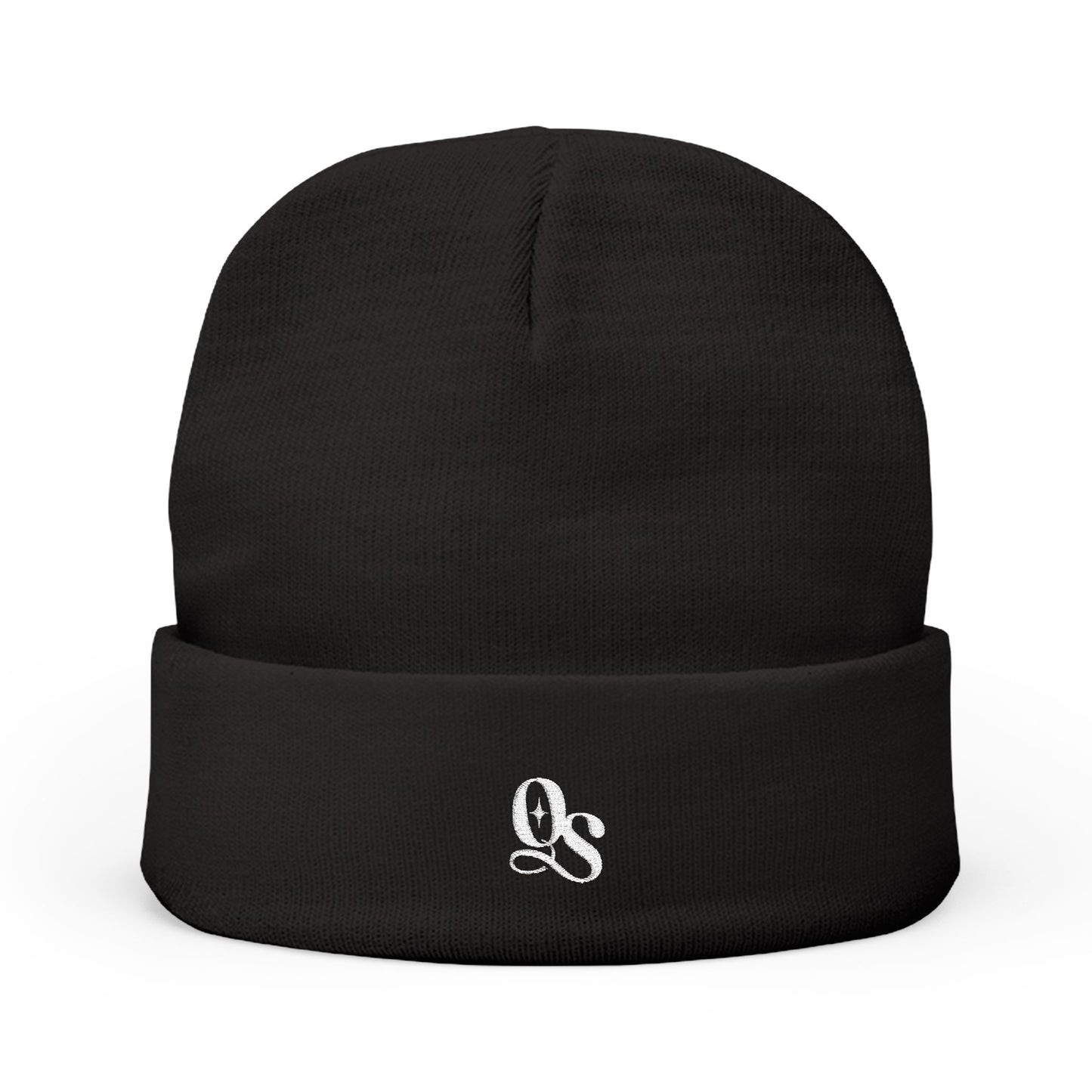 A black cuffed beanie with The Quiet Shelf's 'QS' monogram in embroidery on the front.