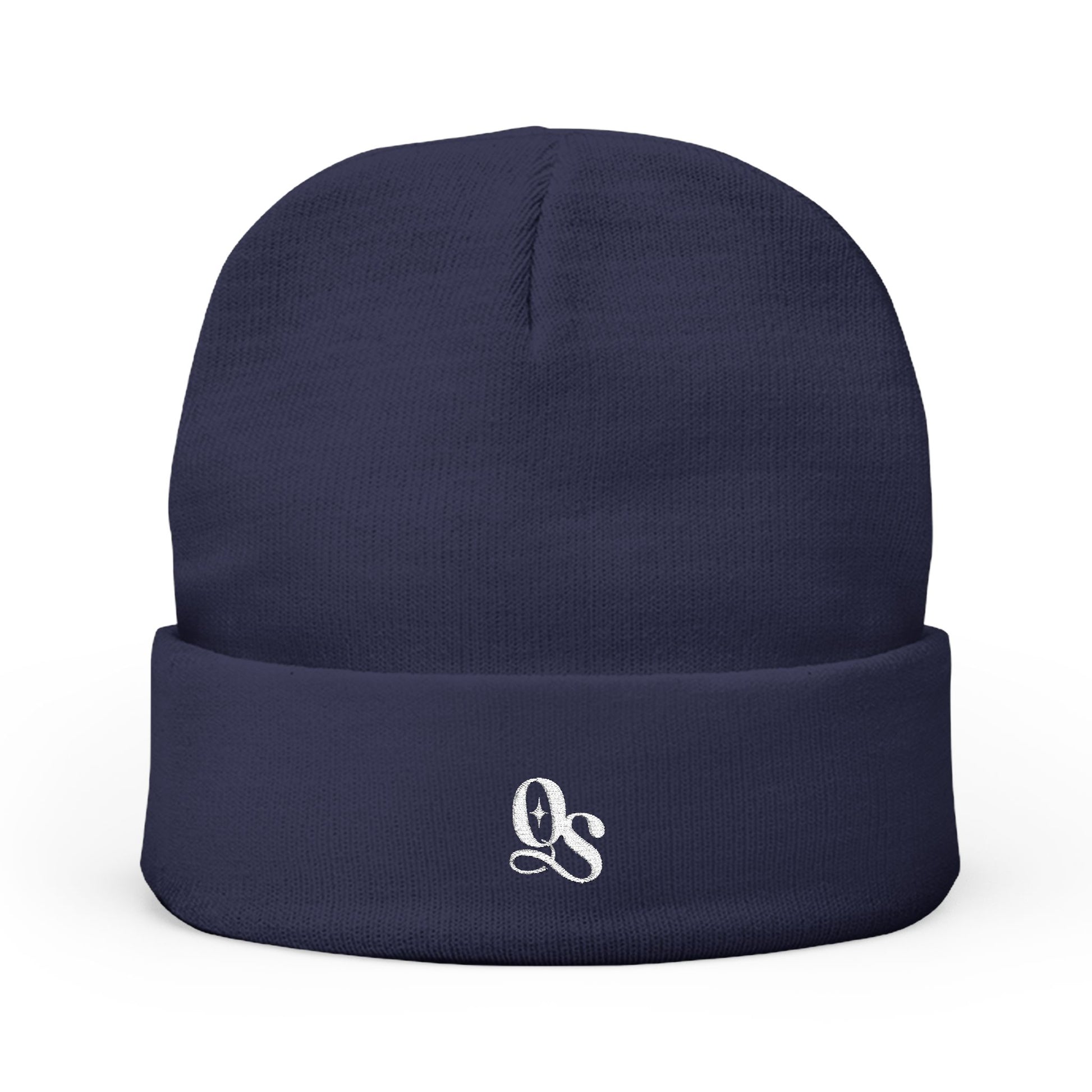 A navy blue cuffed beanie with The Quiet Shelf's 'QS' monogram in embroidery on the front.