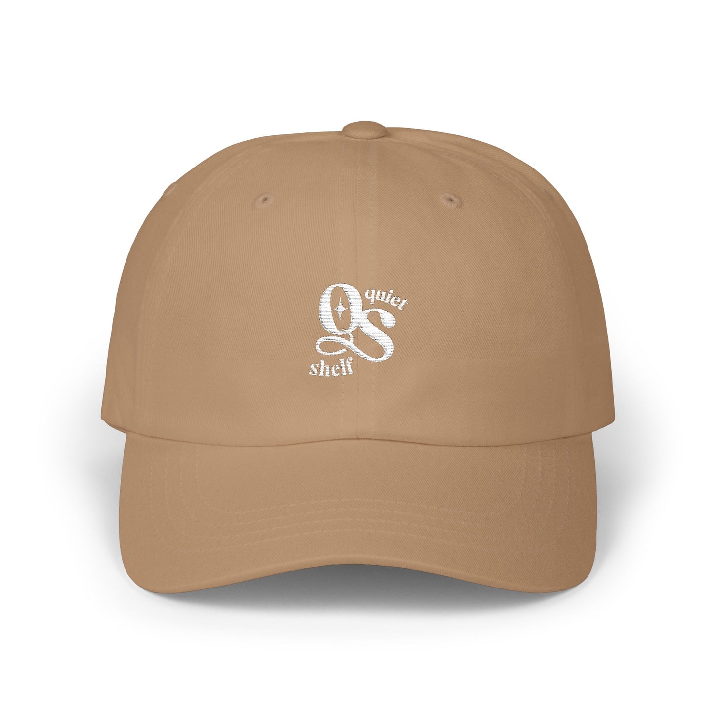 A brown dad hat with the Quiet Shelf's 'QS' logo embroidered in white on the front.
