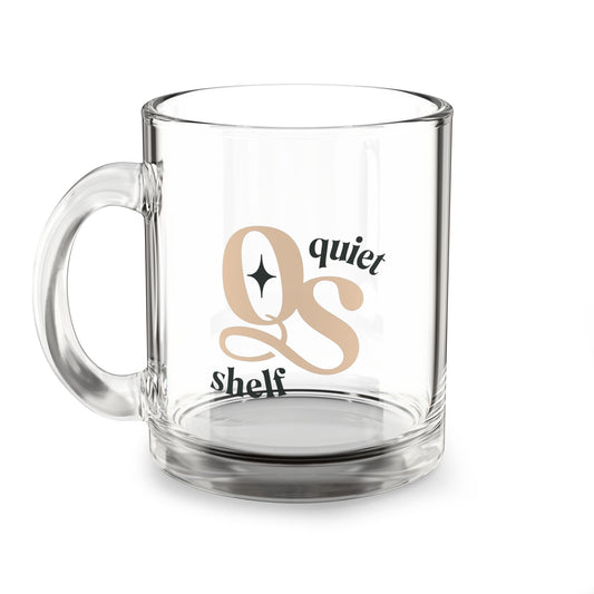 A clear glass mug with a handle, featuring the text 'quiet shelf' and the monogram 'QS' in a stylish font.