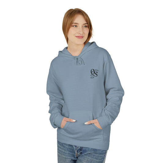 Person wearing a light blue hoodie with a logo on a white background