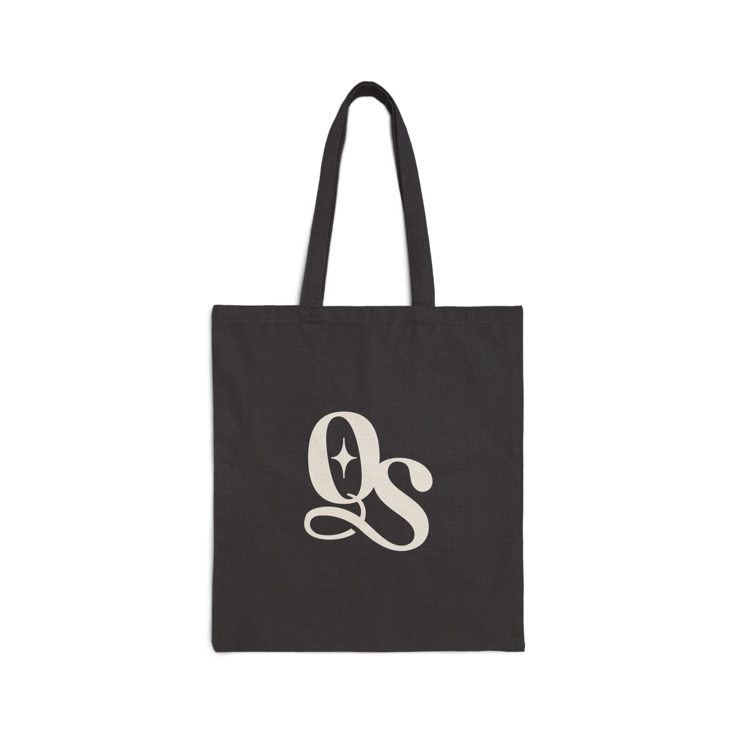 A black cotton canvas tote bag with The Quiet Shelf's 'QS' monogram logo printed in the center.