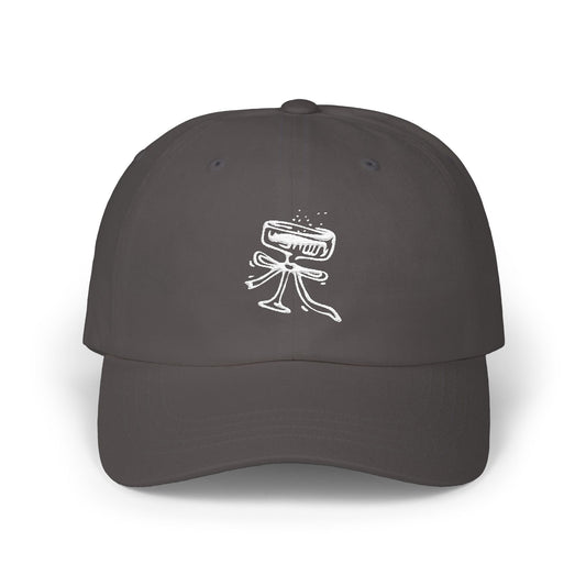 Dark gray cap with a white graphic design on a white background