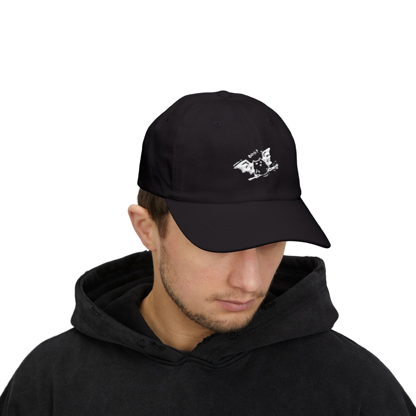 Person wearing a black cap with a logo on a white background