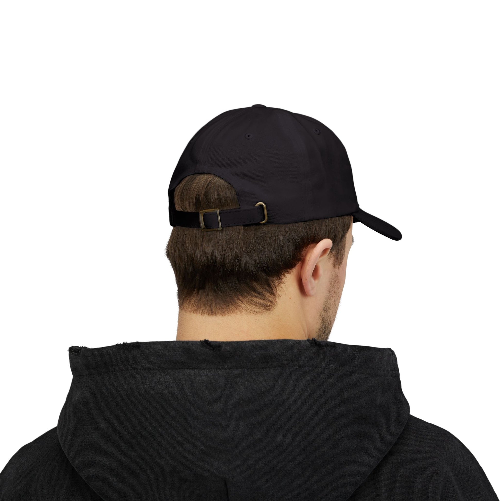 Person wearing a black cap and black hoodie on a white background