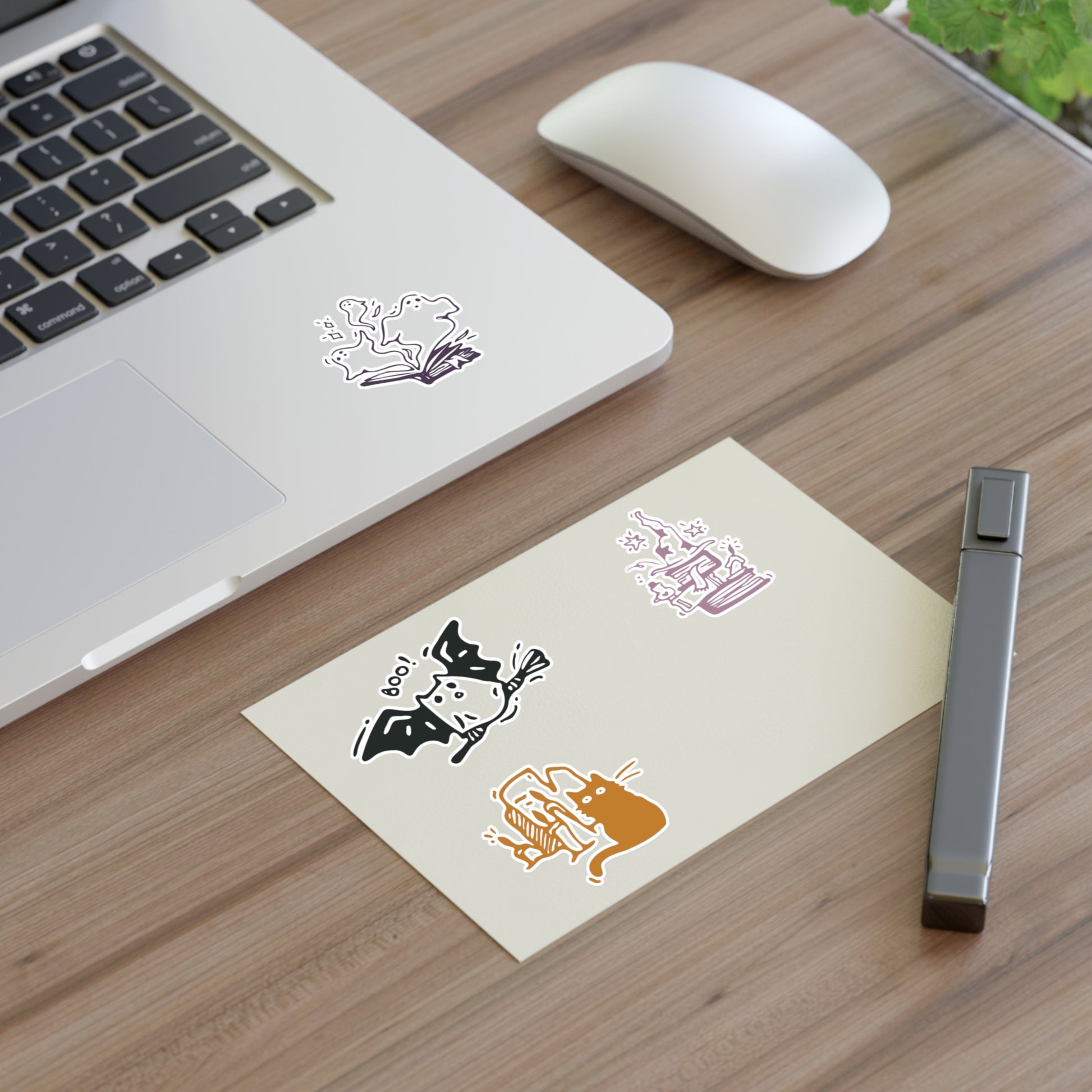 Laptop with stickers on a wooden desk