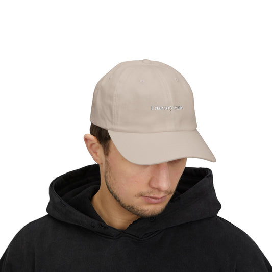 Man wearing a beige cap with "Literary Icon" text on a white background