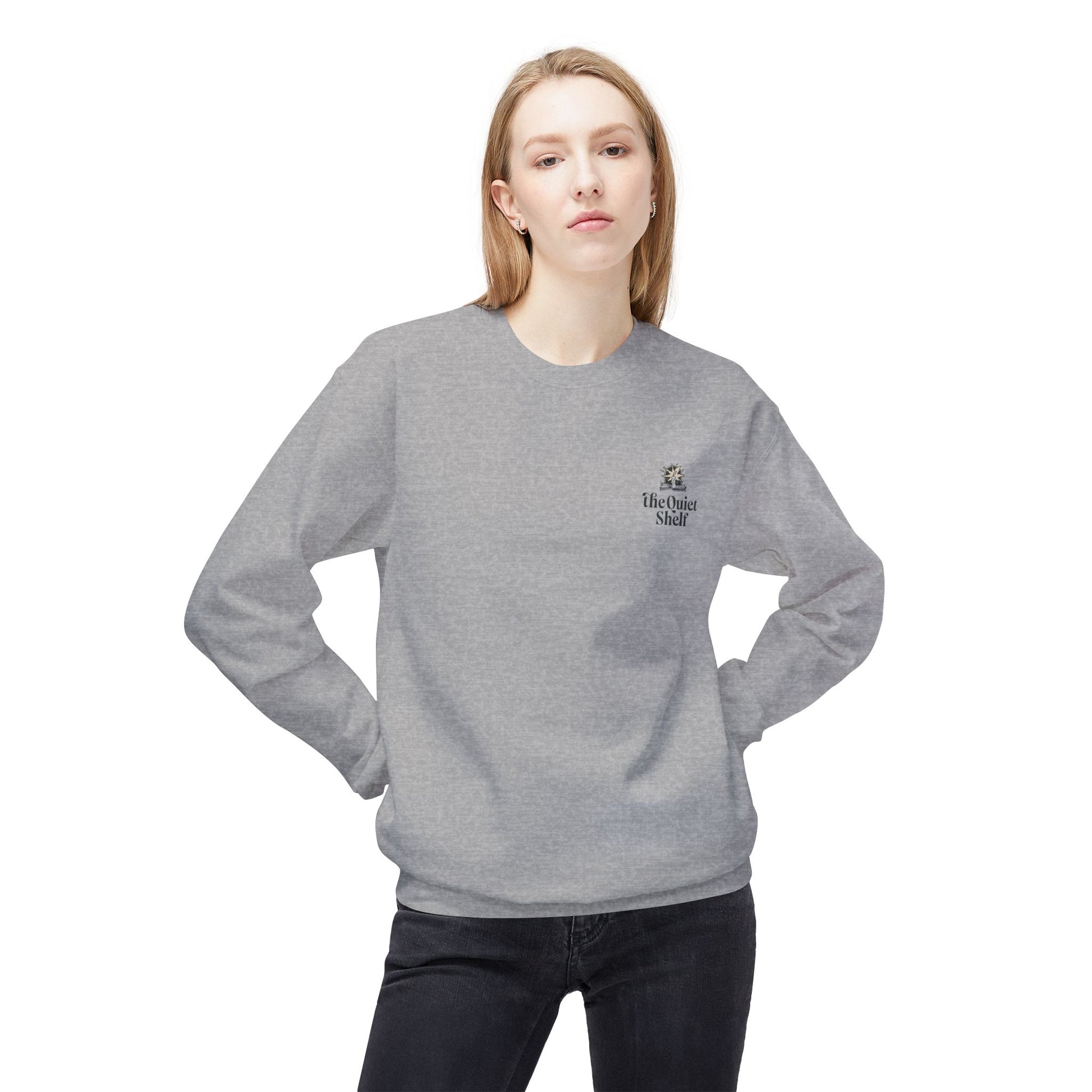Person wearing a gray sweatshirt with a logo on a white background