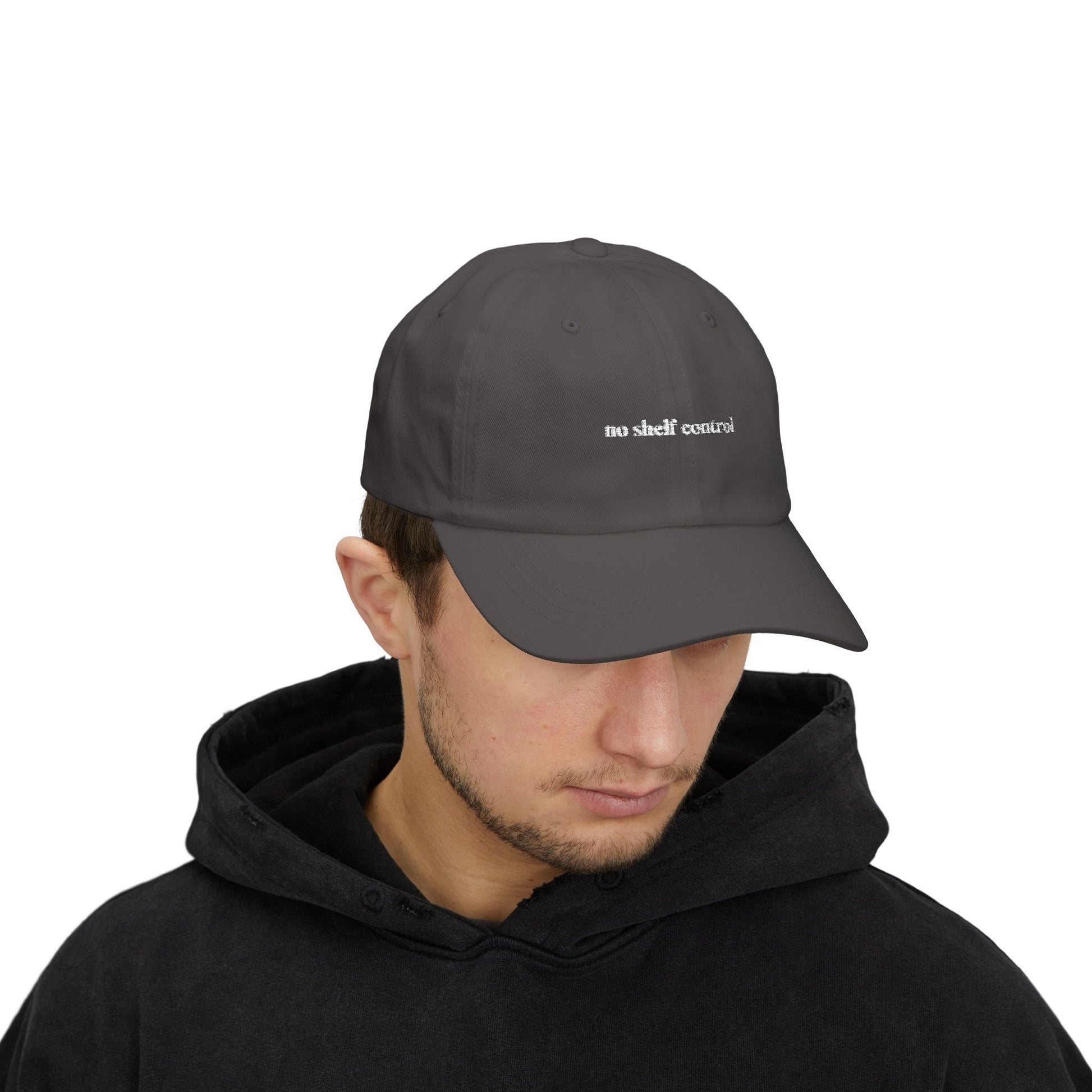 Person wearing a dark gray cap with text on a white background