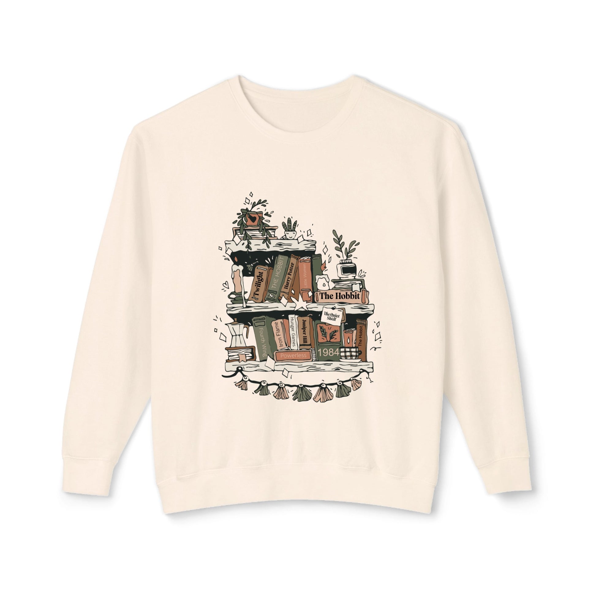 Beige sweatshirt with a graphic of books and plants on a white background