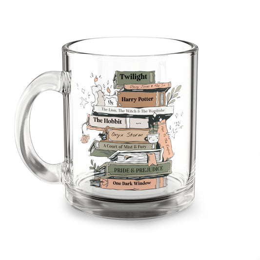 Clear glass mug with book-themed design on a white background