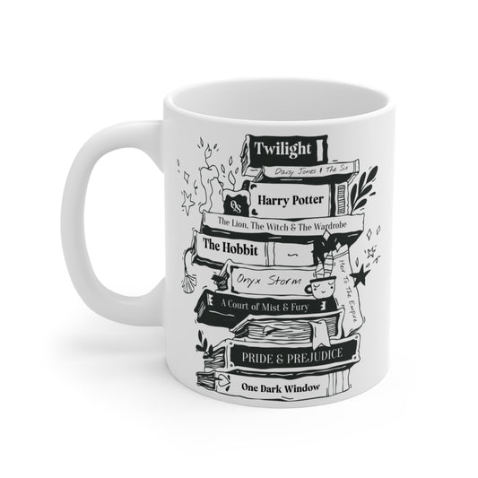 White mug with black book-themed design on a white background