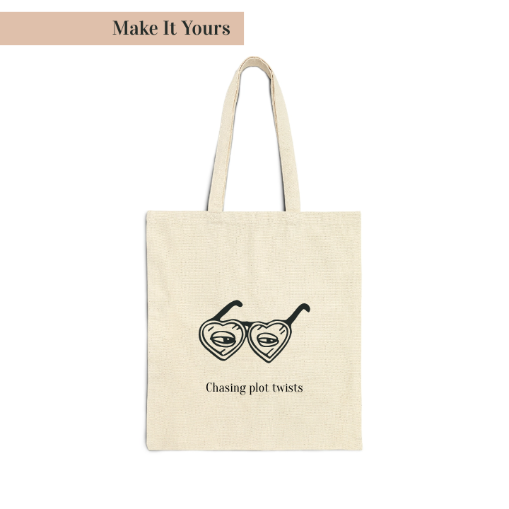 A beige cotton canvas tote bag with black printed text 'Chasing plot twists' and a graphic of a book with glasses.