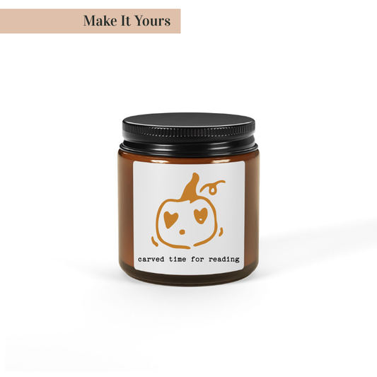 Candle jar with a pumpkin design and text on a white background
