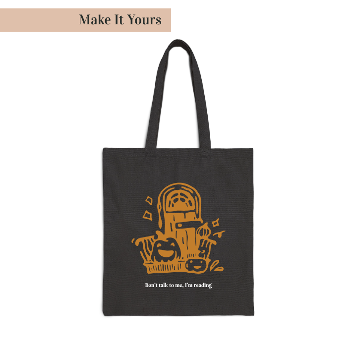 Black tote bag with orange graphic and text on a white background
