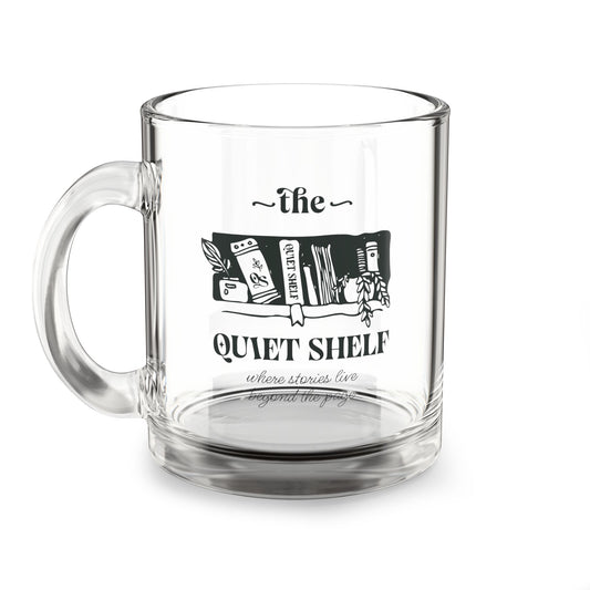 A clear glass mug with 'The Quiet Shelf' logo printed in black on the front.