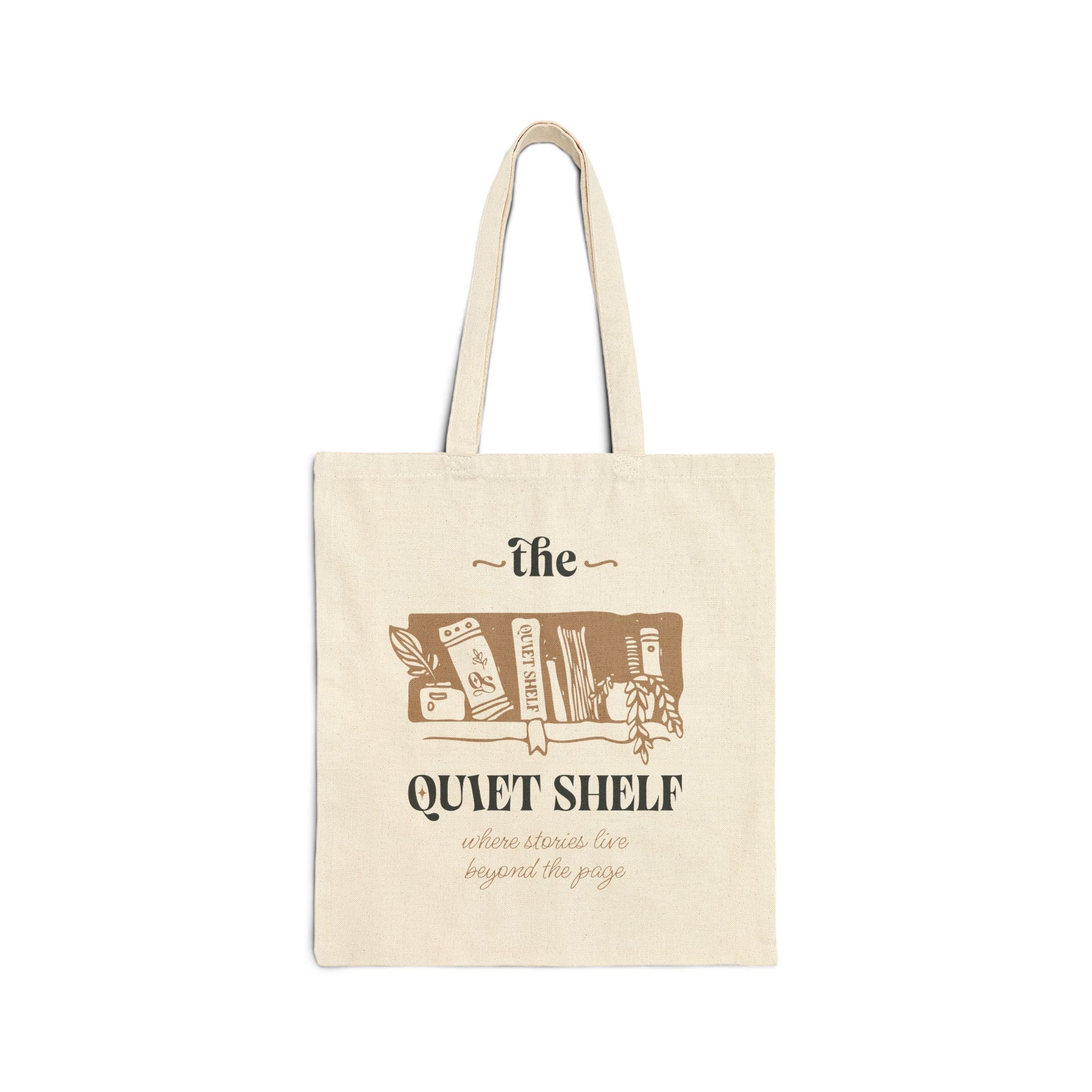 A beige cotton tote bag with 'the Quiet Shelf' logo printed in brown.