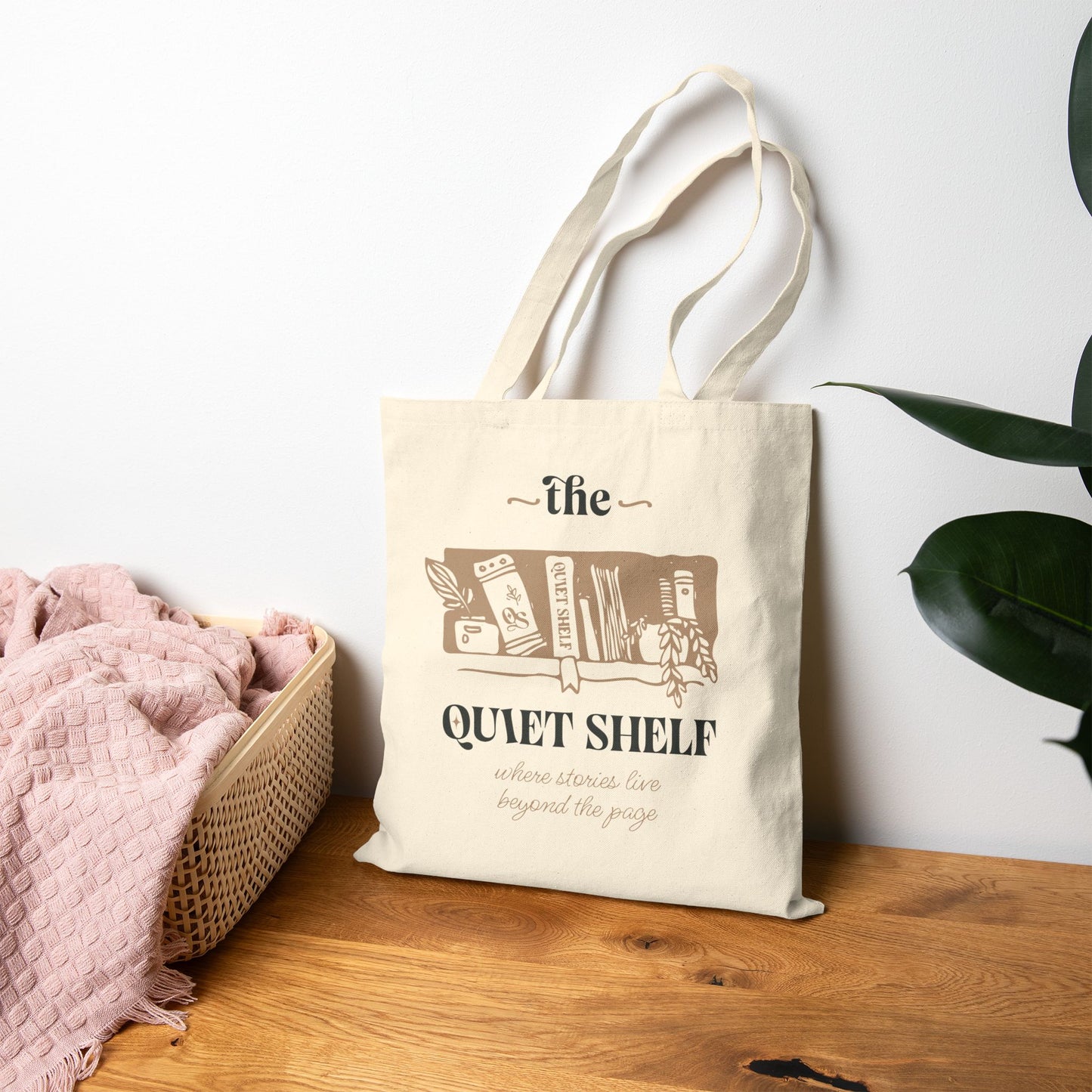Beige tote bag with The Quiet Shelf logo