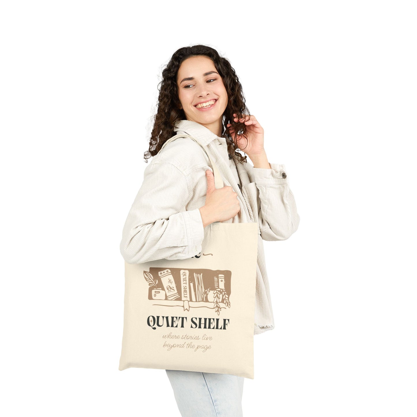 Woman carrying a beige tote bag with The Quiet Shelf logo