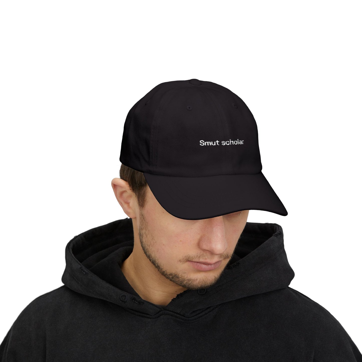 Person wearing a black cap with text on a white background