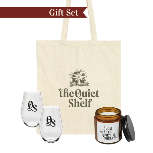 Gift set with two stemless wine glasses, a candle, and a tote bag from 'The Quiet Shelf' brand.